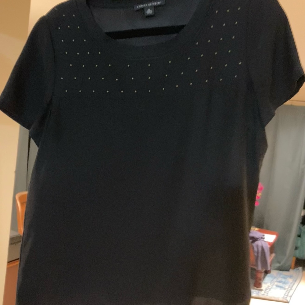 Medium Banana republic black silk top with gold stud embellishment.